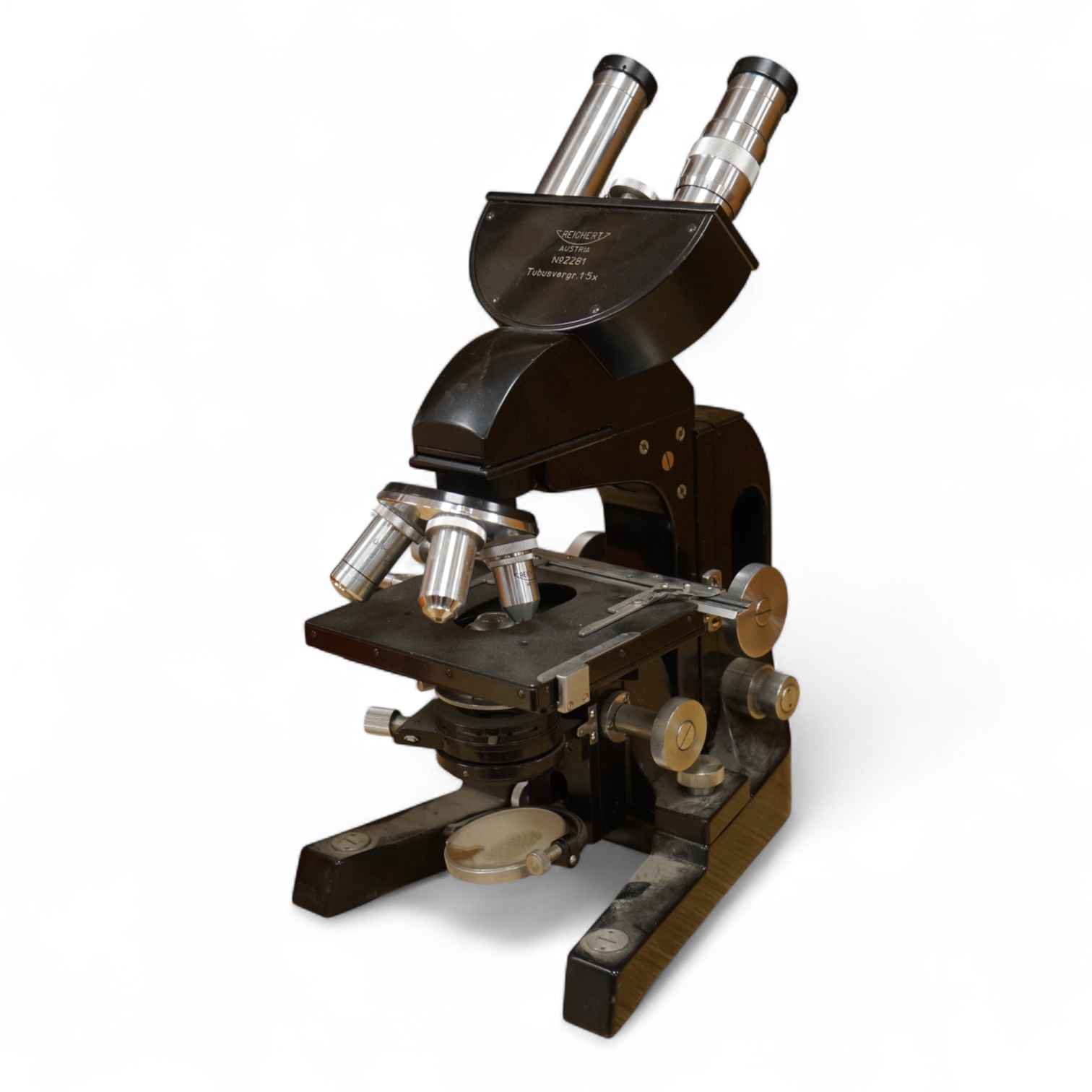 A mid 20th century Reichert, Austria binocular microscope, 34cm high.